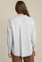 Back view of taupe striped relaxed button front shirt showing rounded hem