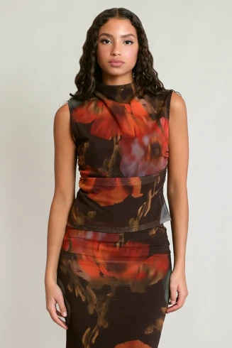 Front view of Dex long sleeve mesh floral top featuring sheer stretch fabric