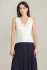 Front view of Black Tape scalloped knit top in cream showing neckline trim