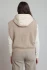 Back view of Dex beige hooded boucle vest showing plush hood and relaxed silhouette