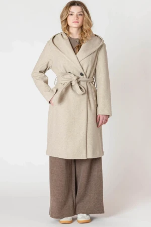 Full-length portrait of model wearing Room 34 stone belted hooded coat styled over outfit