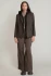 Full-length portrait of model wearing Dex dark brown black hooded blazer styled over a top
