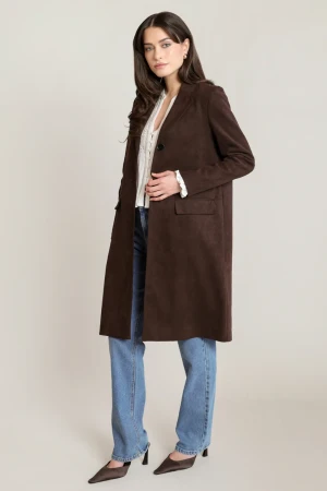 Full-length portrait of model wearing Black Tape chocolate Shaye suede coat styled over outfit