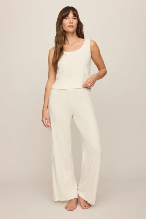 Full-length far portrait of model wearing bone white Z Supply lounge pants styled casually