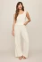 Full-length far portrait of model wearing bone white Z Supply lounge pants styled casually