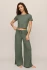 Full-length far portrait of model wearing two-piece Z Supply waffle tee and pant set