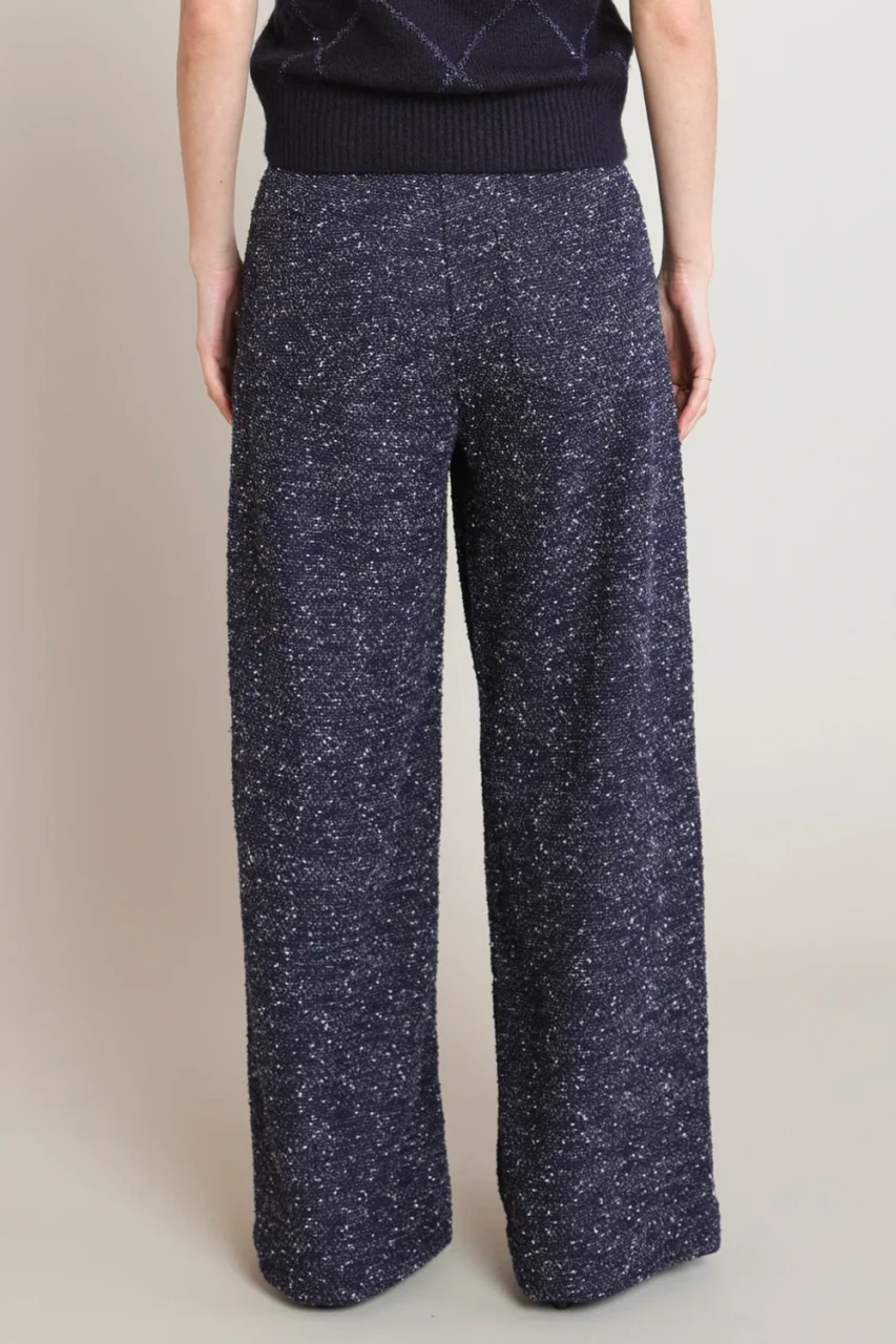 Back view of Black Tape navy blue melange boucle pants showing soft drape and wide leg silhouette