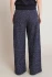 Back view of Black Tape navy blue melange boucle pants showing soft drape and wide leg silhouette