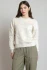 Front view of Dex embroidered sweatshirt in ivory with delicate contrast stitchingFull-length portrait of model wearing Dex ivory embroidered sweatshirt styled with casual denim