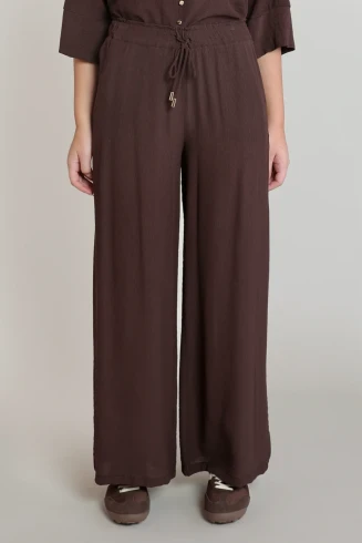 Front view of Dex flowy wide-leg pants in dark chocolate showing high waist and wide leg drape
