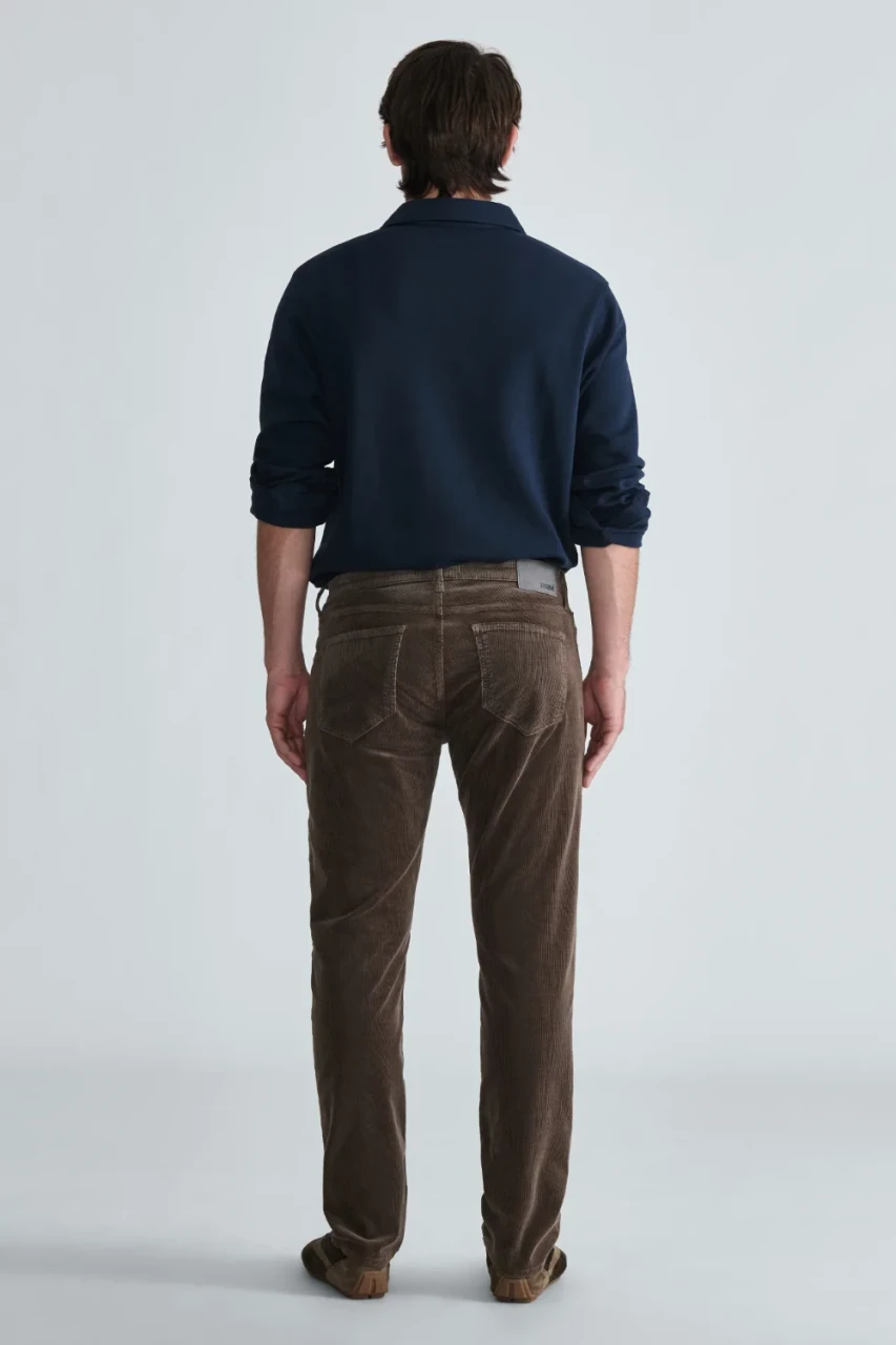 Back view of Mavi Marcus slim straight corduroy pants in acorn showing back pockets and waist yoke