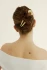 Full-length portrait of a woman wearing the Kōv Essentials French pin in oak against a neutral background