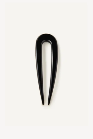 Close-up detail view of the glossy solid black cellulose acetate texture and polished finish