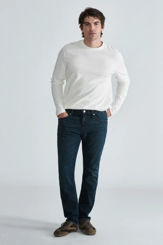 Front view of Mavi Marcus regular rise slim straight leg jeans in deep indigo classic vintage showing waistband and pockets