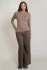 Full-length portrait of model wearing Dex light heather brown long sleeve raglan t-shirt styled with brown pants
