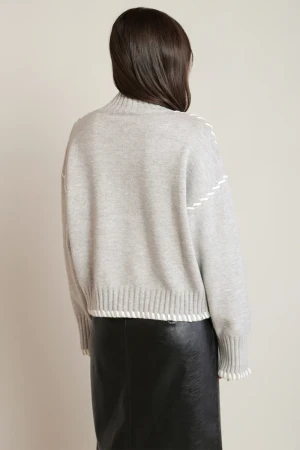 Back view of Black Tape light gray melange stitch turtleneck sweater showing clean drape and knit texture