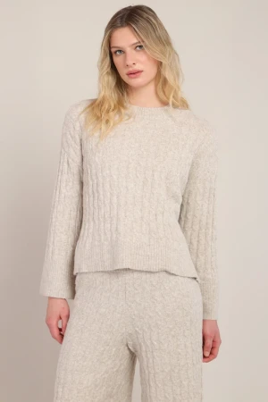 Front view of Room 34 Chalet cable knit sweater in beige showing cable pattern and crew neck