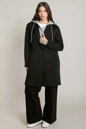 Full-length portrait of model wearing Dex black Cityside convertible hooded coat styled over outfit