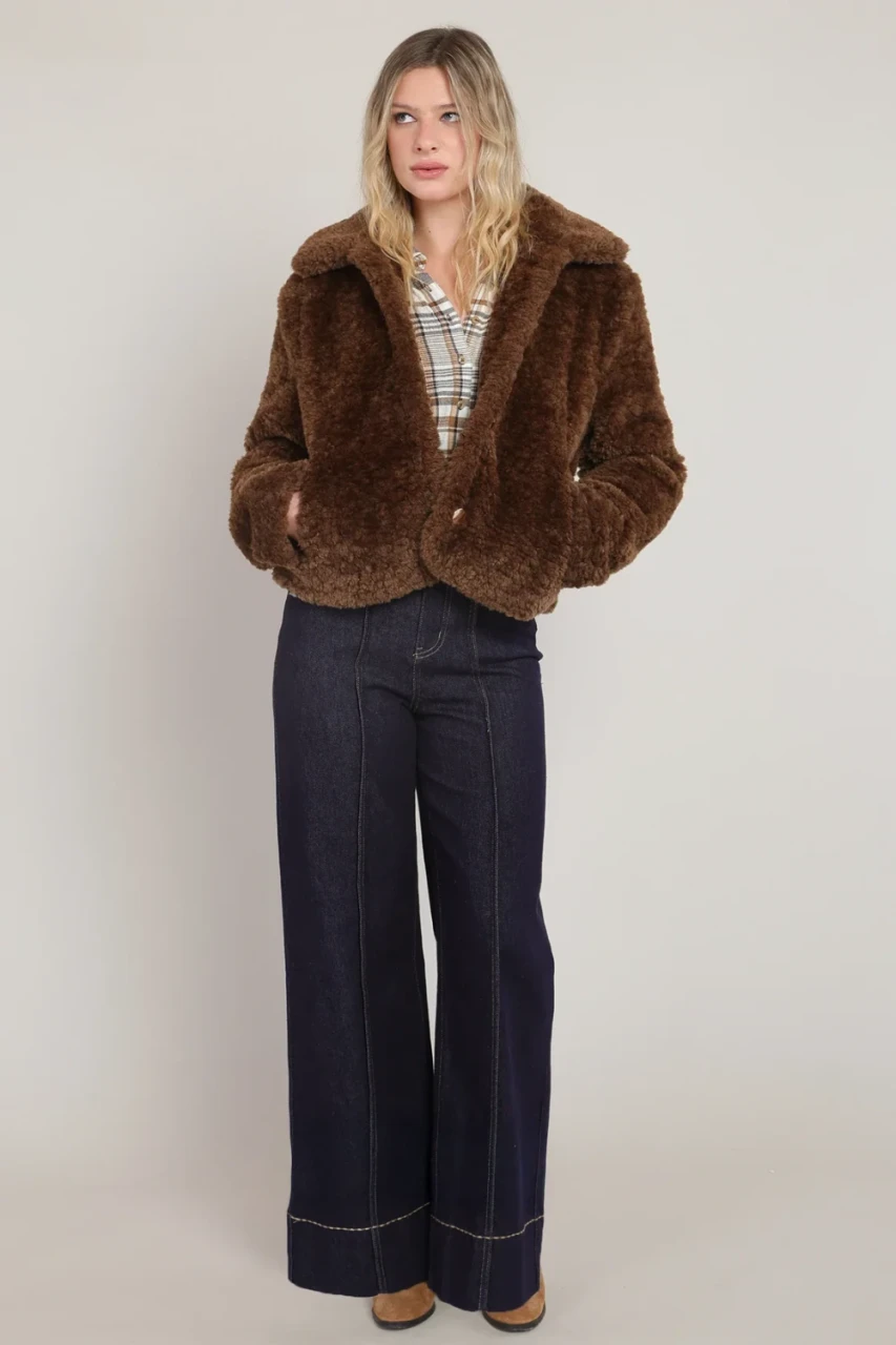 Full-length portrait of model wearing Room 34 minky brown Frostline faux fur coat styled with outfit