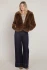 Full-length portrait of model wearing Room 34 minky brown Frostline faux fur coat styled with outfit