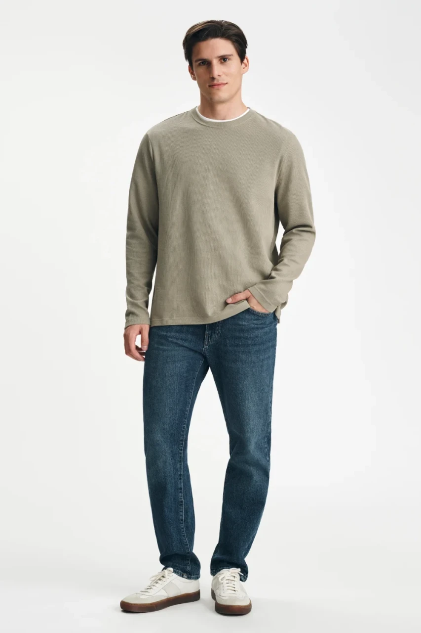 Front view of Mavi Zach regular rise straight leg jeans in dark brushed classic blue showing waistband and pockets