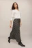 Full-length portrait of model wearing ash black plaid Z Supply Europa maxi skirt styled with a cozy knit top