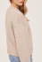 Over the shoulder profile view of model wearing heather pebble grey Gentle Fawn Tova sweater showing the relaxed fit and cropped hem