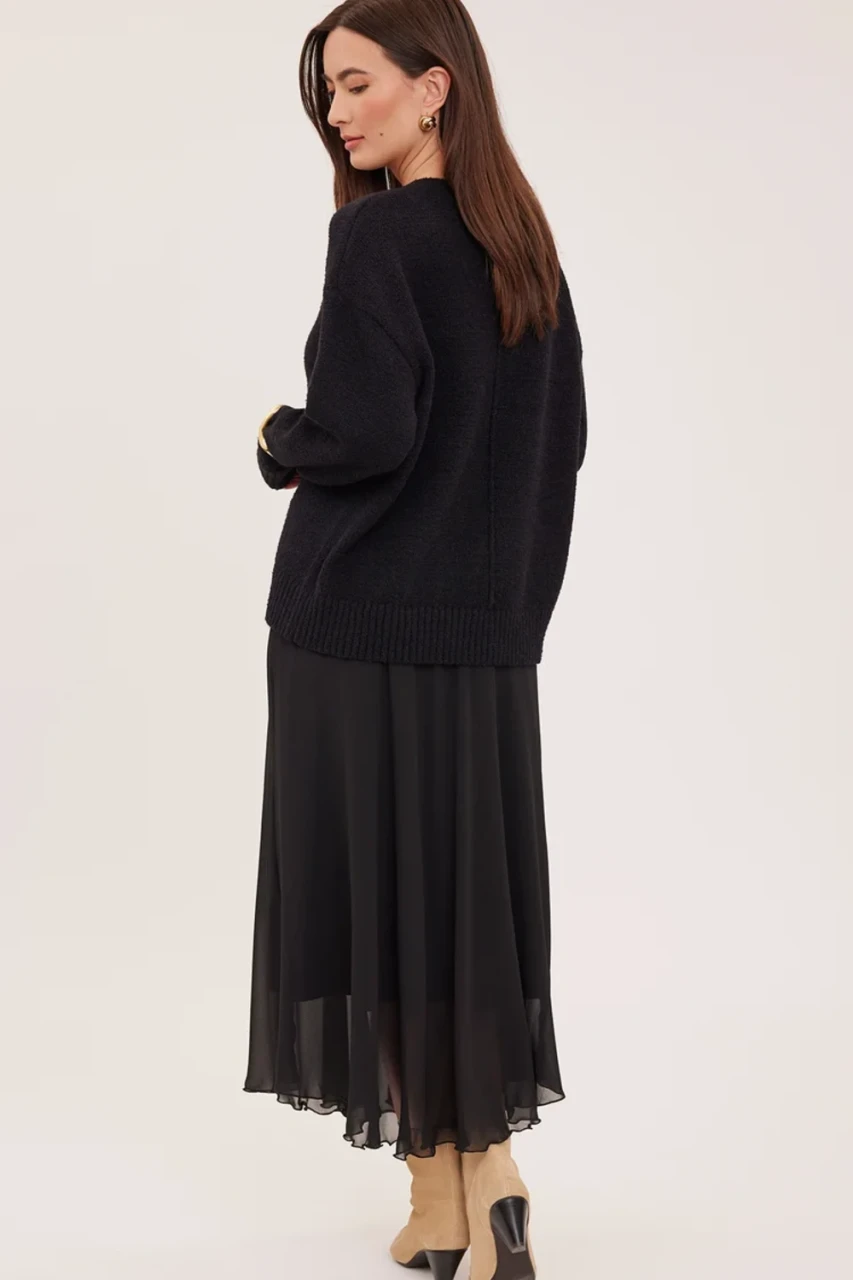Back view of Gentle Fawn black Arianna skirt showing smooth drape and midi length hem