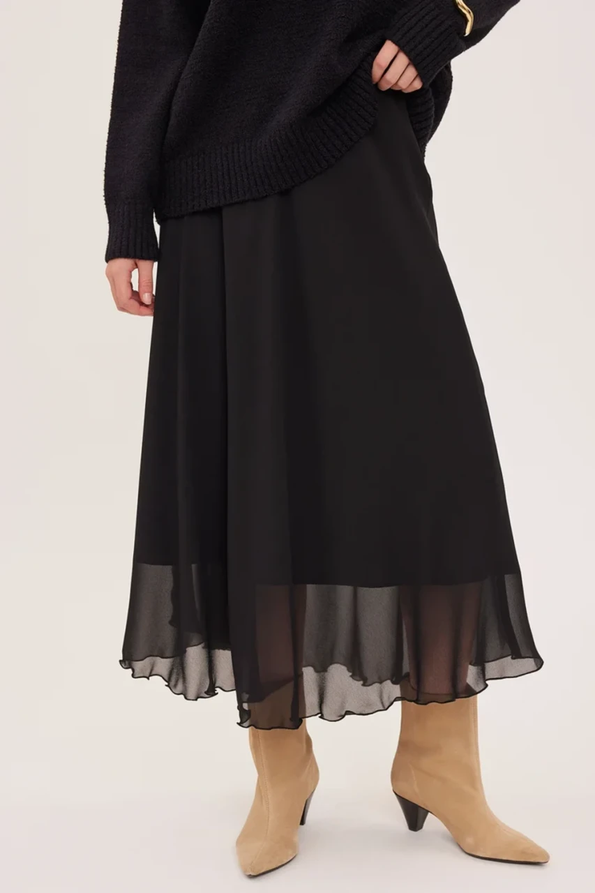 Front view of Gentle Fawn Arianna skirt in black showing scallop trim waist and bias cut chiffon