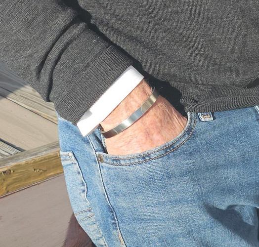 Titan stainless steel magnetic cuff bracelet with a brushed satin finish. Features four powerful magnets and an adjustable fit for everyday wear.