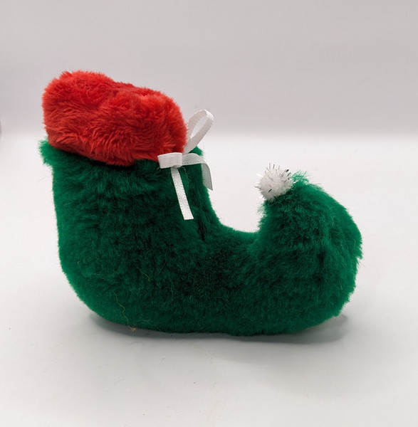 Fun, catnip filled Elf Shore with glitter pom pom toe and pretty bow will create lots of play for your furry friend!
