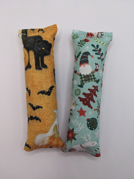 You asked, we delivered! Halloween and Christmas Kick Sticks...one of our best selling toys now in Holiday prints. Tons of fun for your feline friend!
