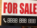 A 4 SALE SIGN WITH DIGITAL NUMBERS THAT MAKE ANY PHONE NUMBER