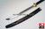 Japanese naginata. 62" Overall length. Stainless steel blade. Wood scabbard w/ decorative dragon design. Pole handle and blade unscrew at the middle for easy storage.
