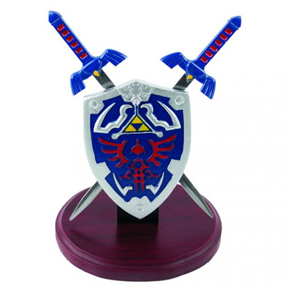 7.5" Height. 4" Mini Hylian shield. TWO removable letter openers . Hardwood display base.