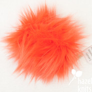 Tangerine 5" faux fur pom pom with yarn ties and stabilizing button attachment