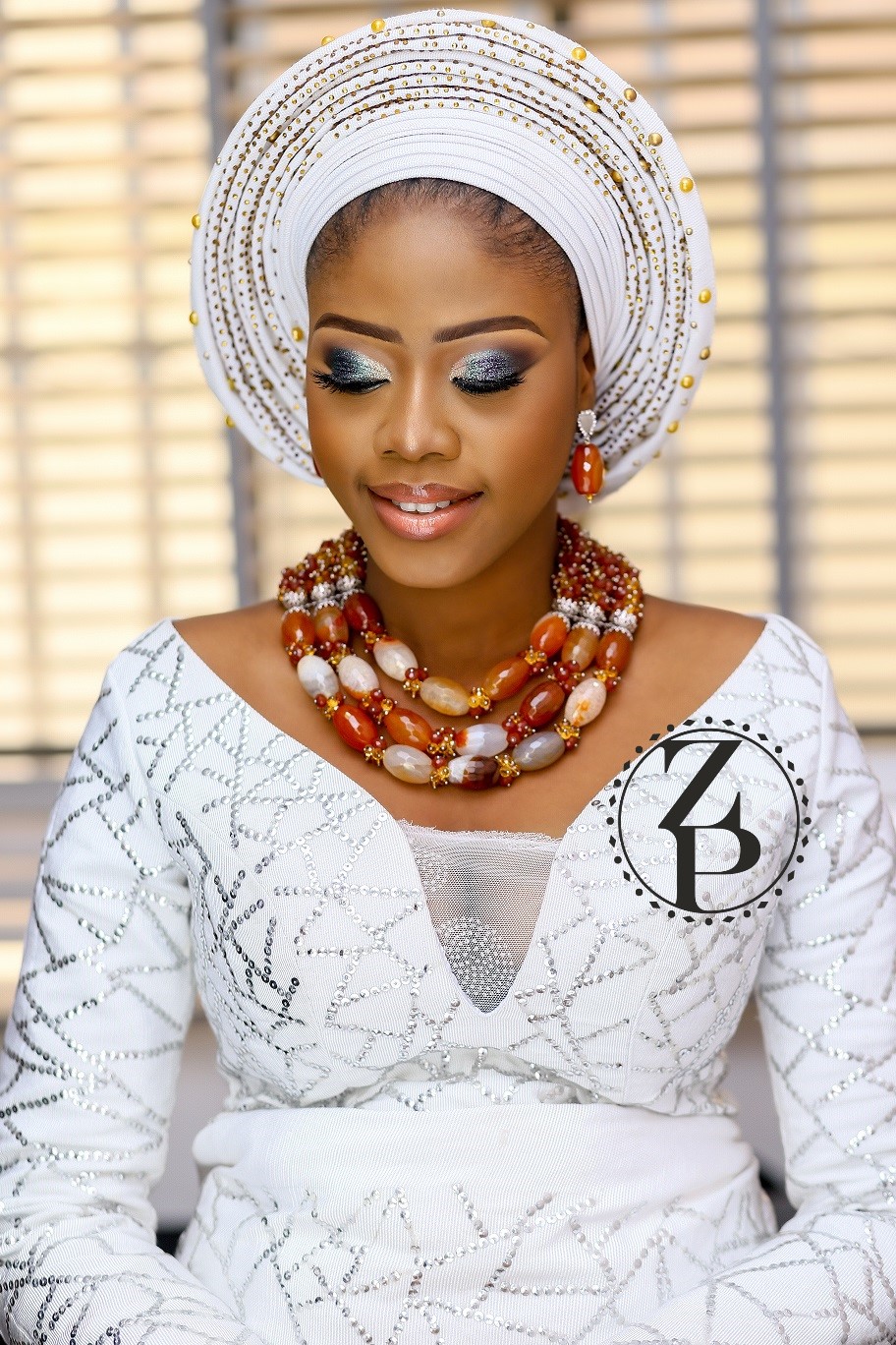 woman-in-nigerian-wedding-outfit-white-iro-and-bub-and-zuri-perle-beads.jpg