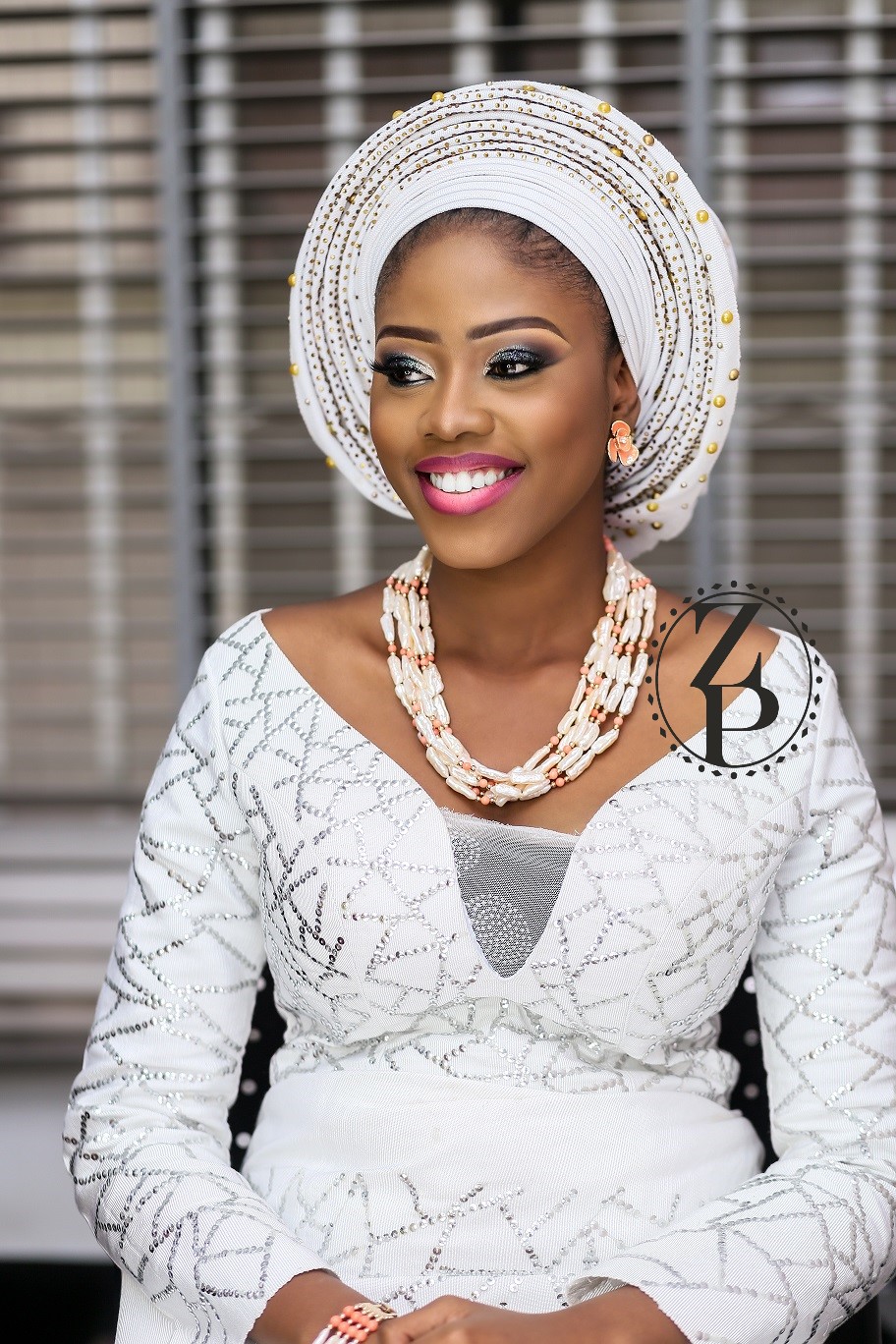 woman-in-yoruba-nigerian-traditional-outfit-pearl-and-coral-jewelry-gele.jpg