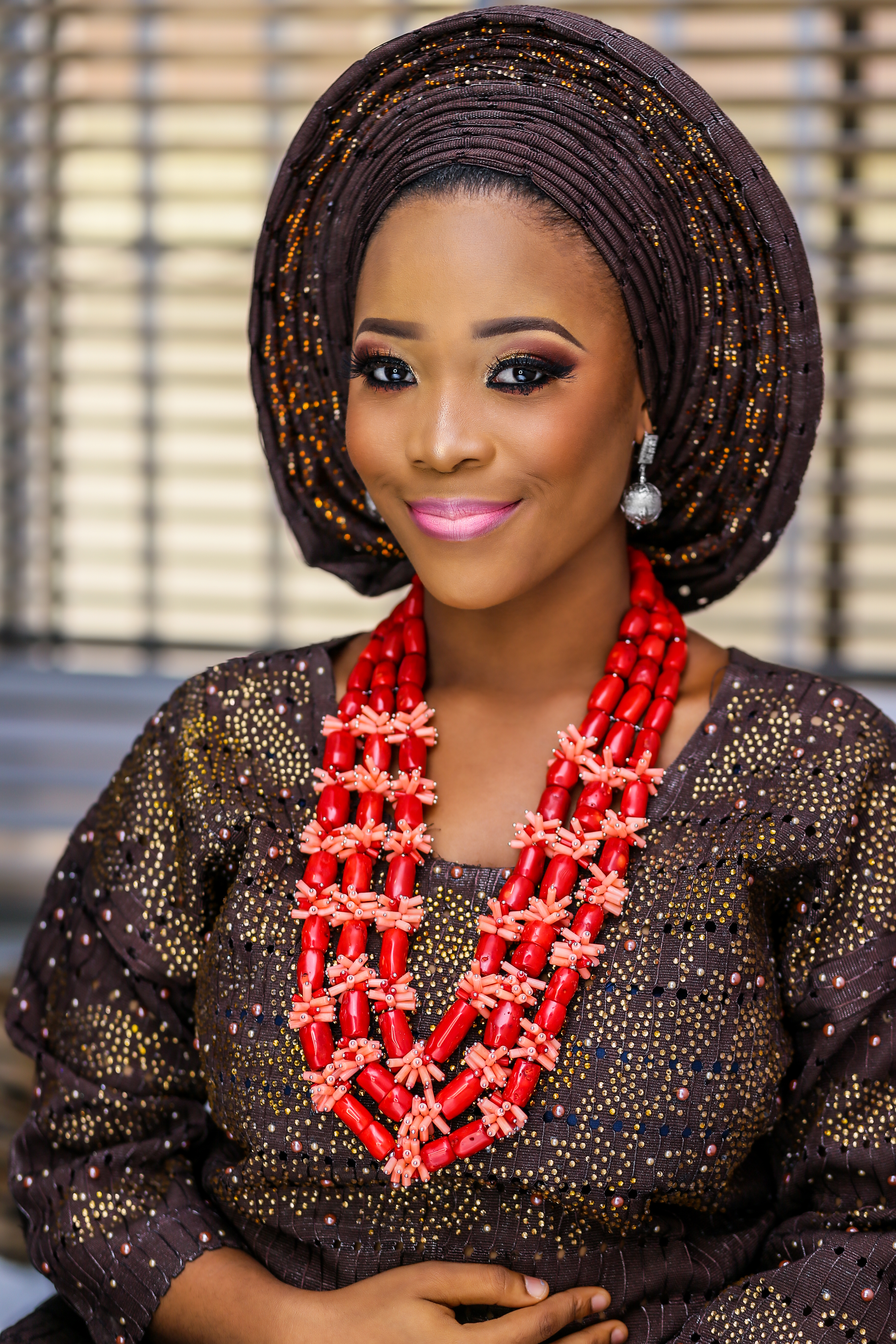 yoruba-woman-in-nigerian-wedding-iro-and-buba-red-coral-beads.jpg