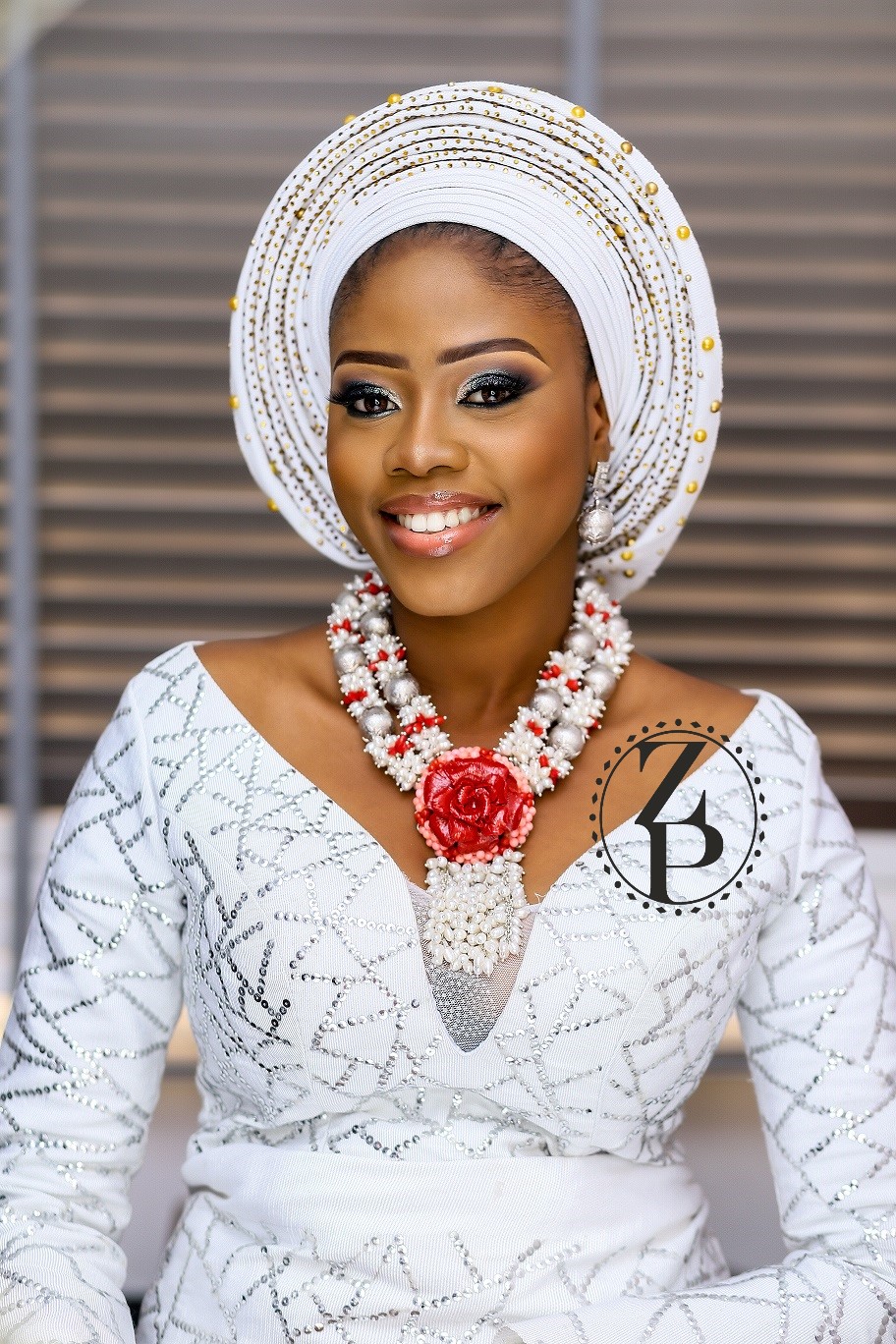 yoruba-woman-in-traditional-outfit-pearl-and-coral-jewelry-gele.jpg