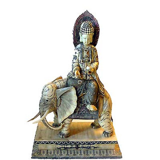 25 inch tall cow bone carving of Kwan Yuen on an elephant