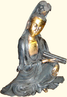 Quan-Yin sitting in black dress