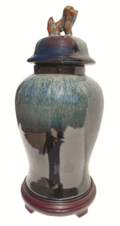 Chinese porcelain jar with lion lid handle jar.  Black drip glaze.