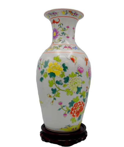 Fish tail vase, white background, colorful, yellow and fuchsia flowers, colorful peacock