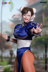 The front view of the PLAY TOY P019EX-A one sixth scale Fighting Goddess action figure highlights the tailored fabric blue fighting dress and iconic spiked wristbands.