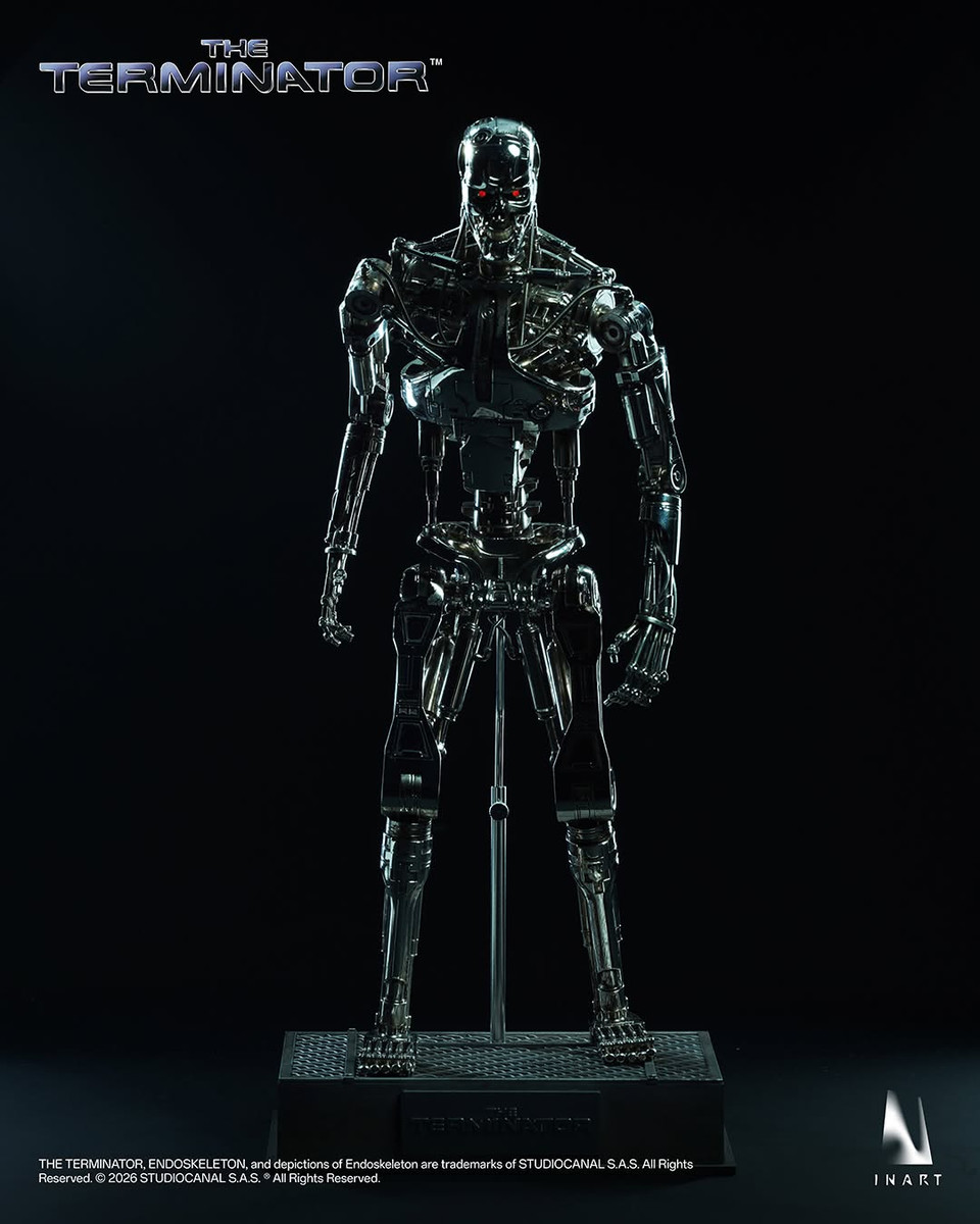 Promotional display of the InArt Terminator Endoskeleton figure posed dynamically on its custom post apocalyptic diorama display base.