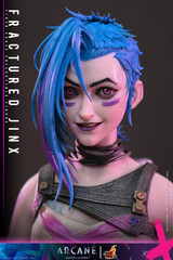 The Hot Toys Arcane Fractured Jinx one sixth scale figure is showcasing her detailed head sculpt with rolling eyeballs and vibrant blue braided hair.