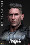 A close up photograph highlights the hyper realistic facial details wounds and separate rolling eyeball mechanism of the Jon Bernthal head sculpt.