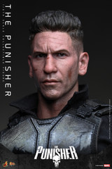 A close up photograph highlights the hyper realistic facial details wounds and separate rolling eyeball mechanism of the Jon Bernthal head sculpt.