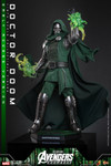 Hot Toys Doctor Doom holding a concept art magical book while displaying translucent green flame power effect hands.